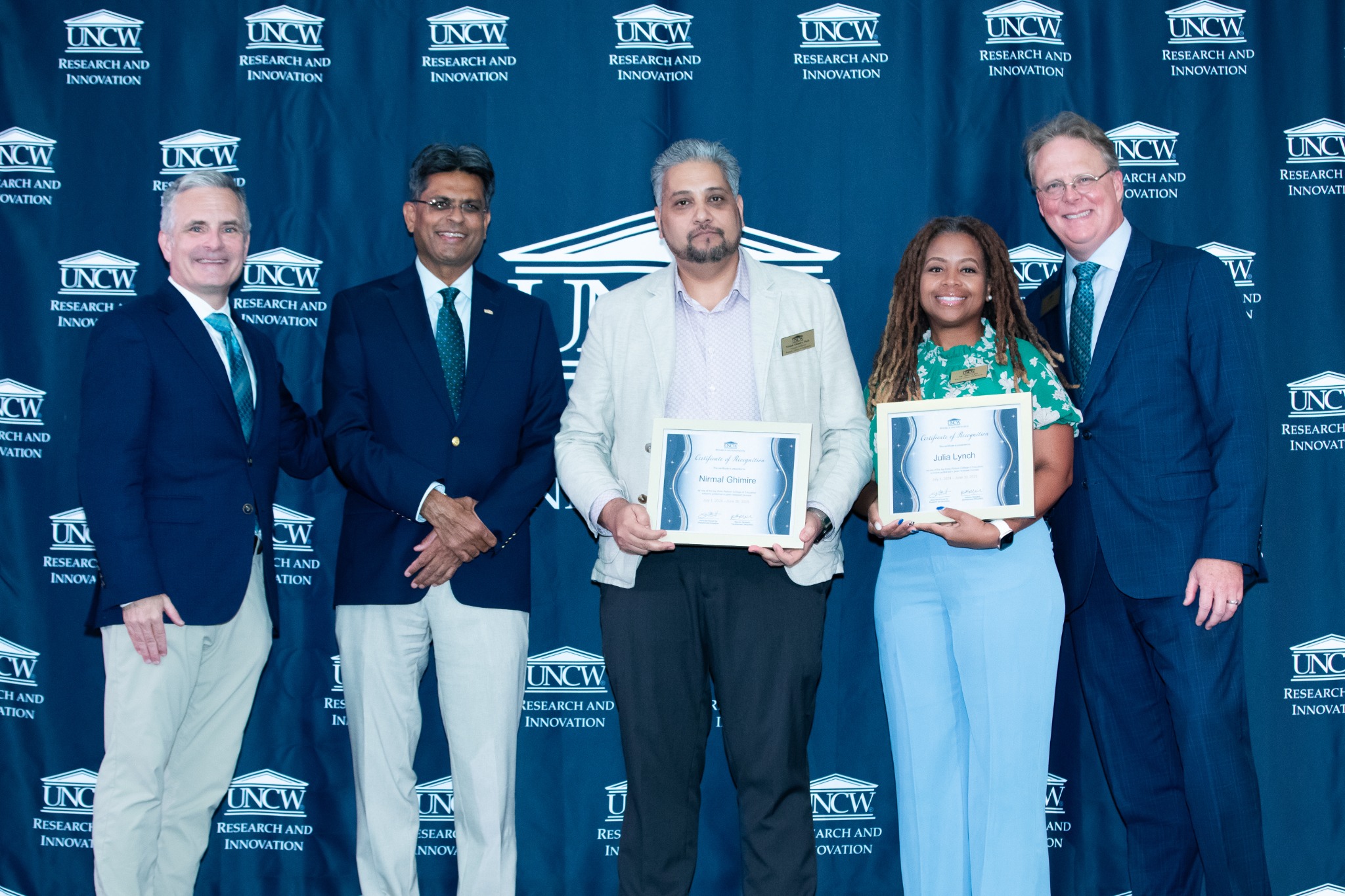 Nirmal Ghimire with colleagues at UNCW’s research celebration